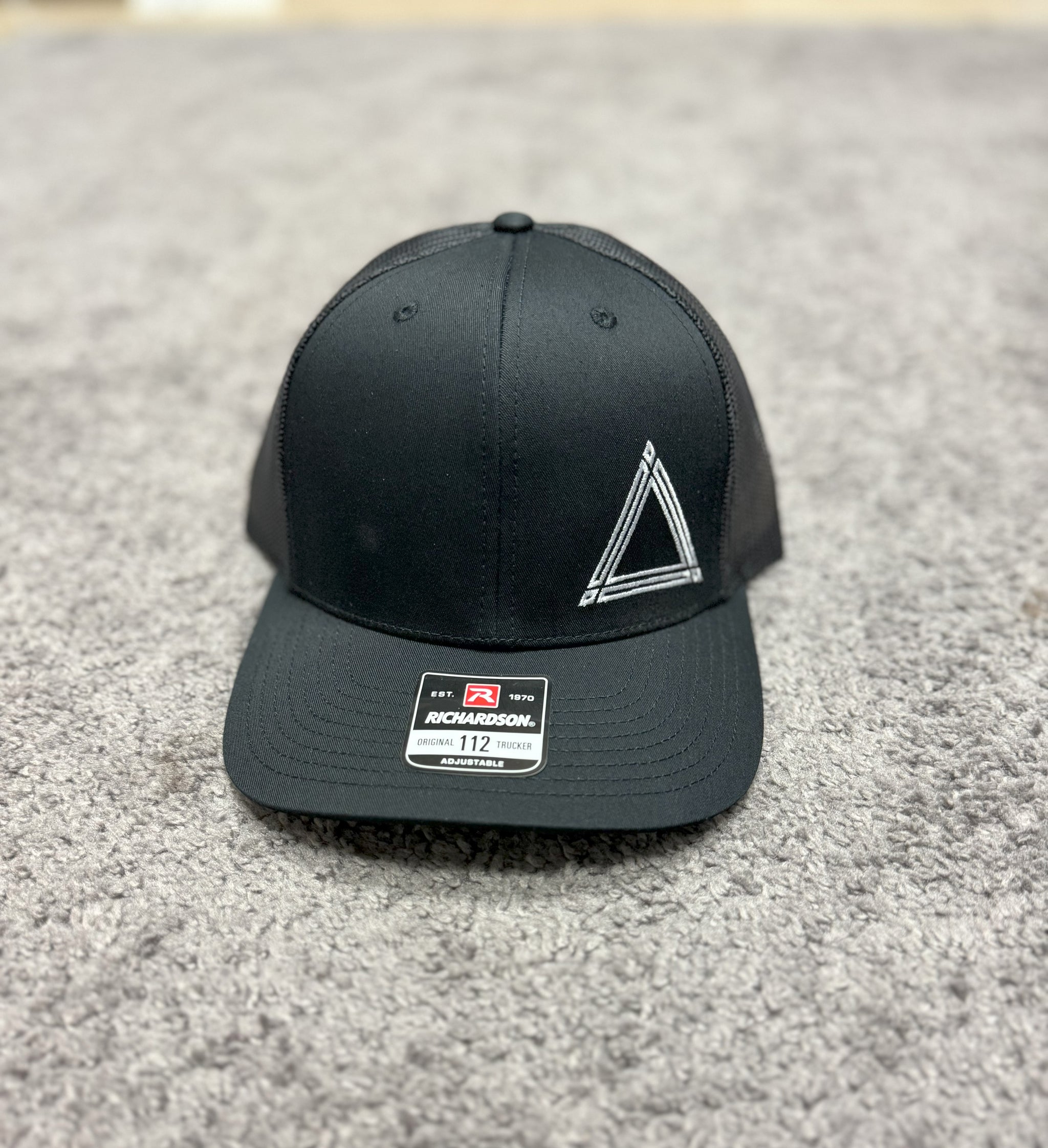 Black Stitch Logo Trucker Hat